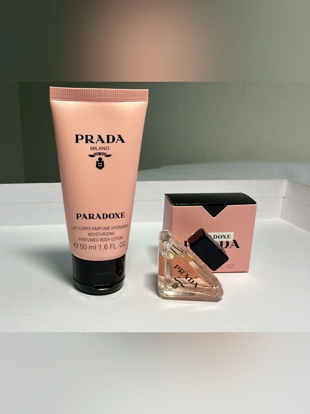 New,unused authentic Prada Paradoxe Pink Body Lotionn$ with Mini Fragrancee3 Set